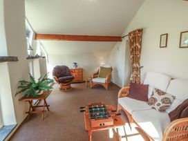 A living room with a sofa and coffee table at Hawkshead Hall in Hawkshead