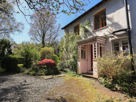 A house with a garden and pathway at Rose Cottage Coniston
