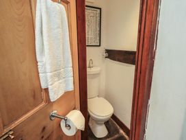 A bathroom with a toilet and sink at Rose Cottage Coniston in coniston
