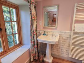 A bathroom with a sink and a window at Rose Cottage Coniston