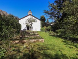 A house with a garden and steps at Rose Cottage Coniston in coniston