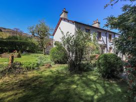A house with garden and trees at Rose Cottage Coniston coniston