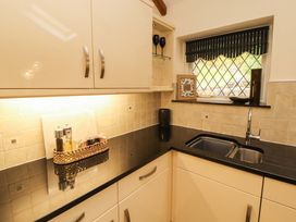A kitchen with countertop and sink at Durham Bridge Barn in Crosthwaite