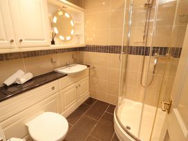 A bathroom with a sink and shower at Durham Bridge Barn in Crosthwaite