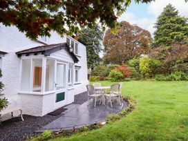 A patio area with a table and chairs at Ecclerigg Old Farm Nr. Ambleside