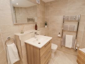 A bathroom with a sink and a toilet at Chapelside Cottage in Ambleside