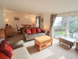 A living room featuring a sofa coffee table and dining area at Mardale in Ambleside