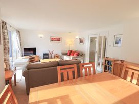 A living room with a sofa and television at Mardale in Ambleside
