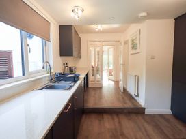 A kitchen with sink and cabinets at Mardale in Ambleside