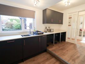 A kitchen with sink, cabinets, and appliances at Mardale in Ambleside