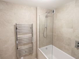 A bathroom with a bathtub and shower at Mardale in Ambleside