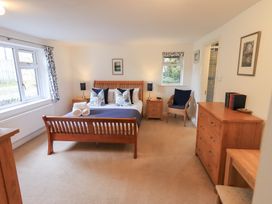 A bedroom with a bed and furniture at Mardale in Ambleside