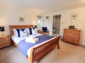 A bedroom with a bed and a dresser at Mardale Ambleside