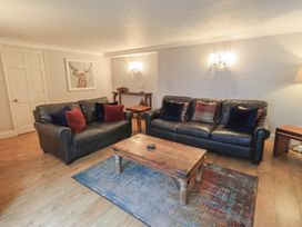 A living room with sofas and a coffee table at Chapel Hill Cottage in Ambleside