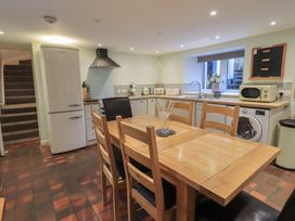 A kitchen with a table and chairs at Chapel Hill Cottage in Ambleside
