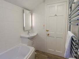 A bathroom with a sink and bathtub at Chapel Hill Cottage in Ambleside