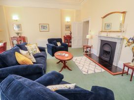 A living room with a sofa and fireplace at South View in Keswick