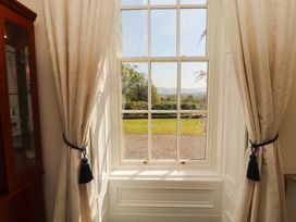 A window with curtains and a view in a living room at South View Keswick