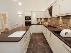 A kitchen with modern cabinets and appliances at South View in Keswick
