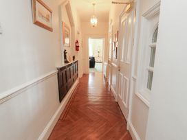 A hallway with doors and decorative items at South View in Keswick