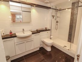 A bathroom with a shower and sink at South View in Keswick