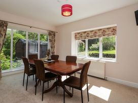 A dining room with a table and chairs at Elterwater Lodge in Elterwater
