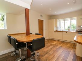 A kitchen with a table and chairs at Elterwater Lodge in Elterwater