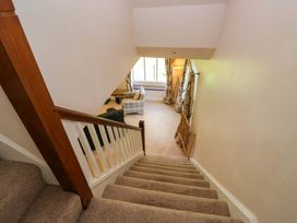 A landing with a staircase and seating area at Elterwater Lodge, Elterwater