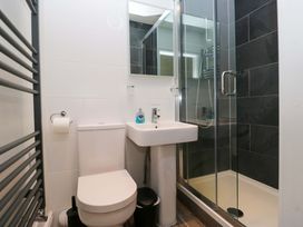 A bathroom with a toilet, sink, and shower at Elterwater Lodge in Elterwater