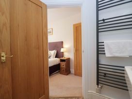 A bedroom view with a bed and nightstand at Elterwater Lodge in Elterwater