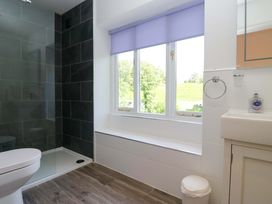 A bathroom with a shower and toilet at Elterwater Lodge in Elterwater