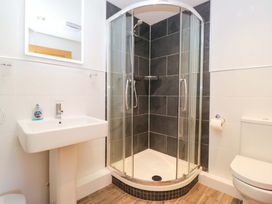 A bathroom with a shower, sink, and toilet at Elterwater Lodge in Elterwater