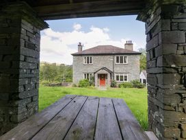 A house with windows and garden view at Elterwater Lodge in Elterwater