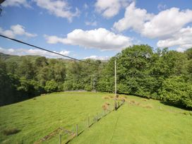 A view of trees and grass at Elterwater Lodge in Elterwater