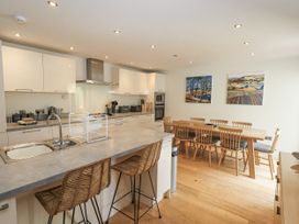 A kitchen with dining table and chairs at No 7 in Ambleside