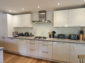 A kitchen with appliances and storage at No 7 in Ambleside