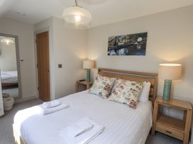 A bedroom with a double bed and bedside tables at No 7 Ambleside
