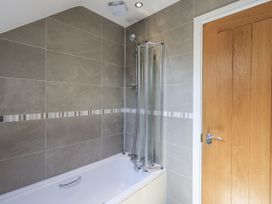 A bathroom with a bathtub and shower at No 7 in Ambleside
