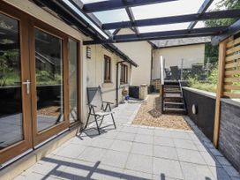 An outdoor seating area with a chair and stairs at No 7 in Ambleside