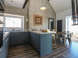 A kitchen with a sink and countertop at Sea View in Llandudno
