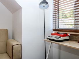 An inner office with a typewriter and lamp at Sea View in Llandudno