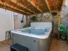 An outdoor area with a hot tub and plants at Sea View in Llandudno