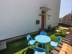An outdoor area with chairs and tables at Sea View in Llandudno