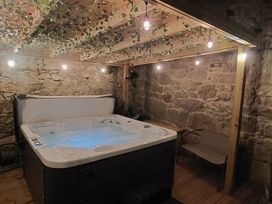A hot tub with lights and wooden features at Seascape in Llandudno
