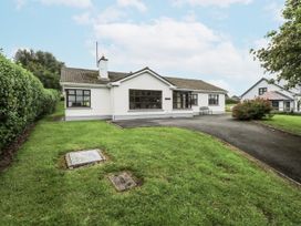 A bungalow with a driveway and grass garden at Brow O' The Hill in Ballyshannon