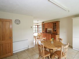 A kitchen with wooden furniture and a radiator at Brow O' The Hill in Ballyshannon