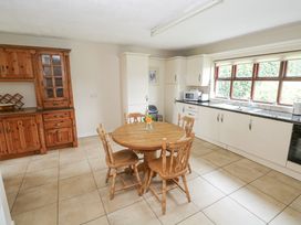 A kitchen with a dining table and chairs at Brow O' The Hill in Ballyshannon