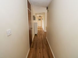 A hallway with wooden flooring and light fixture at Brow O' The Hill in Ballyshannon