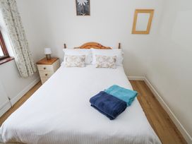 A bedroom with a bed and bedside table at Brow O' The Hill in Ballyshannon