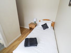 A bedroom with a single bed and nightstand at Brow O' The Hill in Ballyshannon